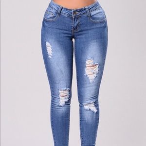 Mid Rise Skinny Leg Distressed Jeans